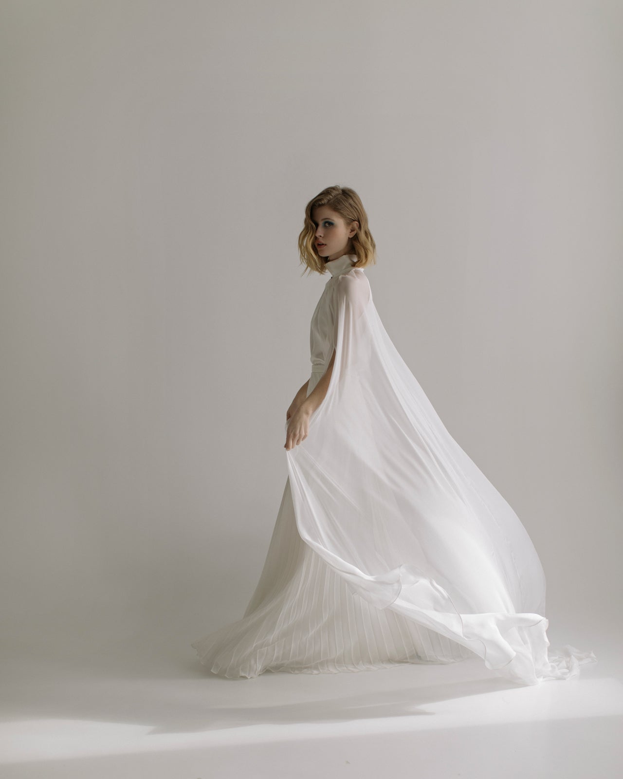 Halterneck bridal gown with plated skirt – Sumarokova Atelier