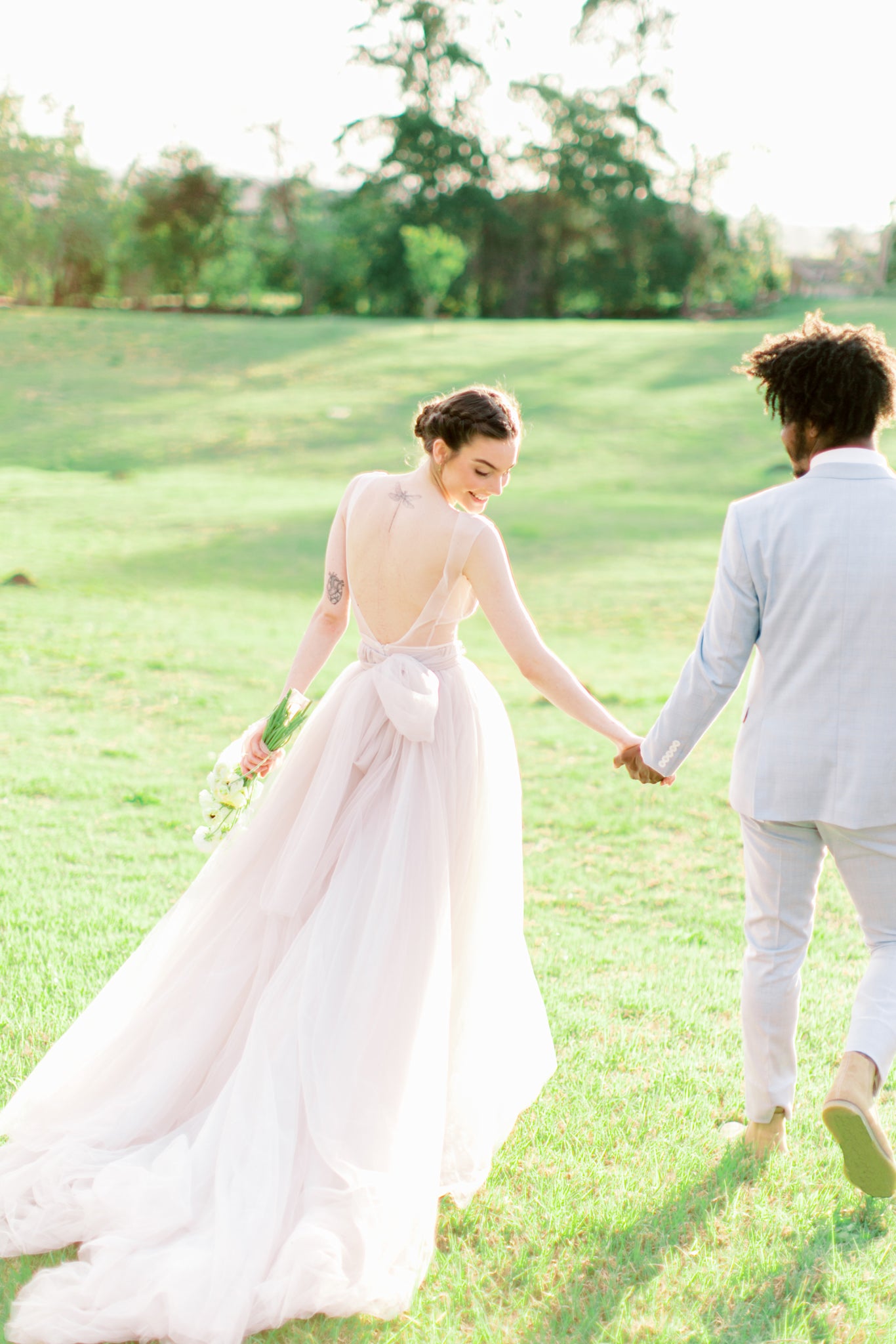 Long full wedding dress with an open back photo 9